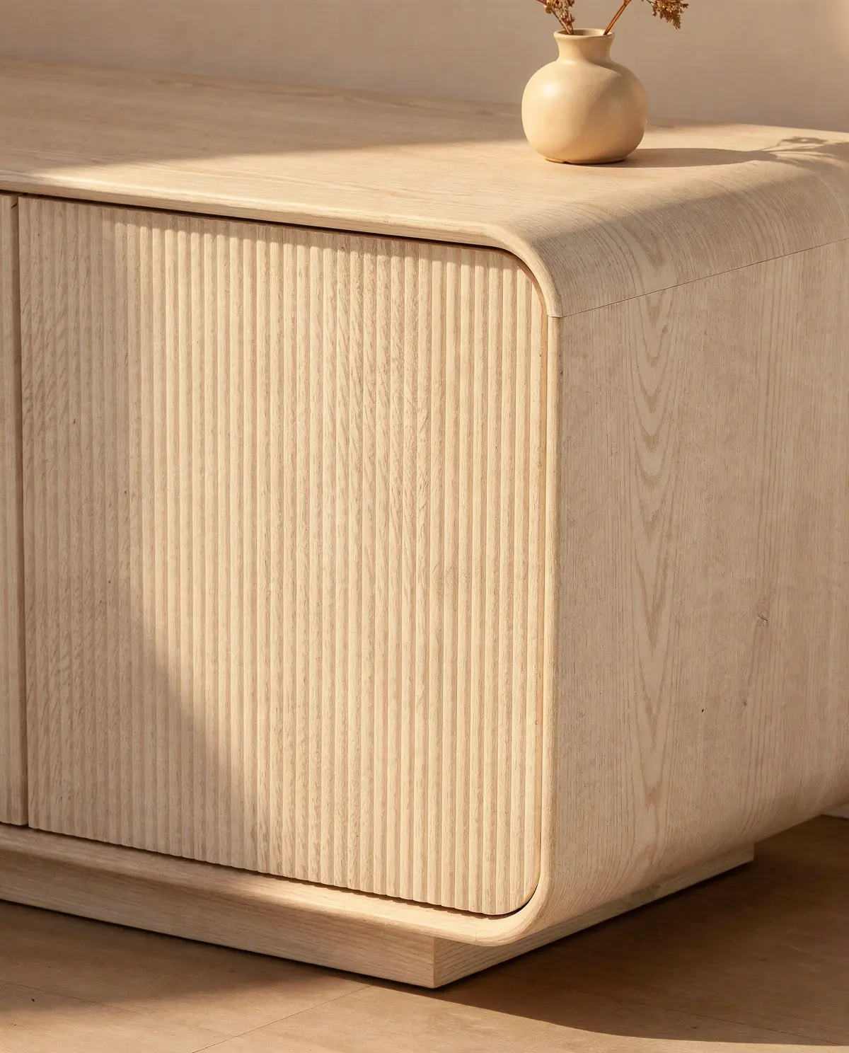 Close-up of the reeded oak doors and rounded corner of the Alma sideboard