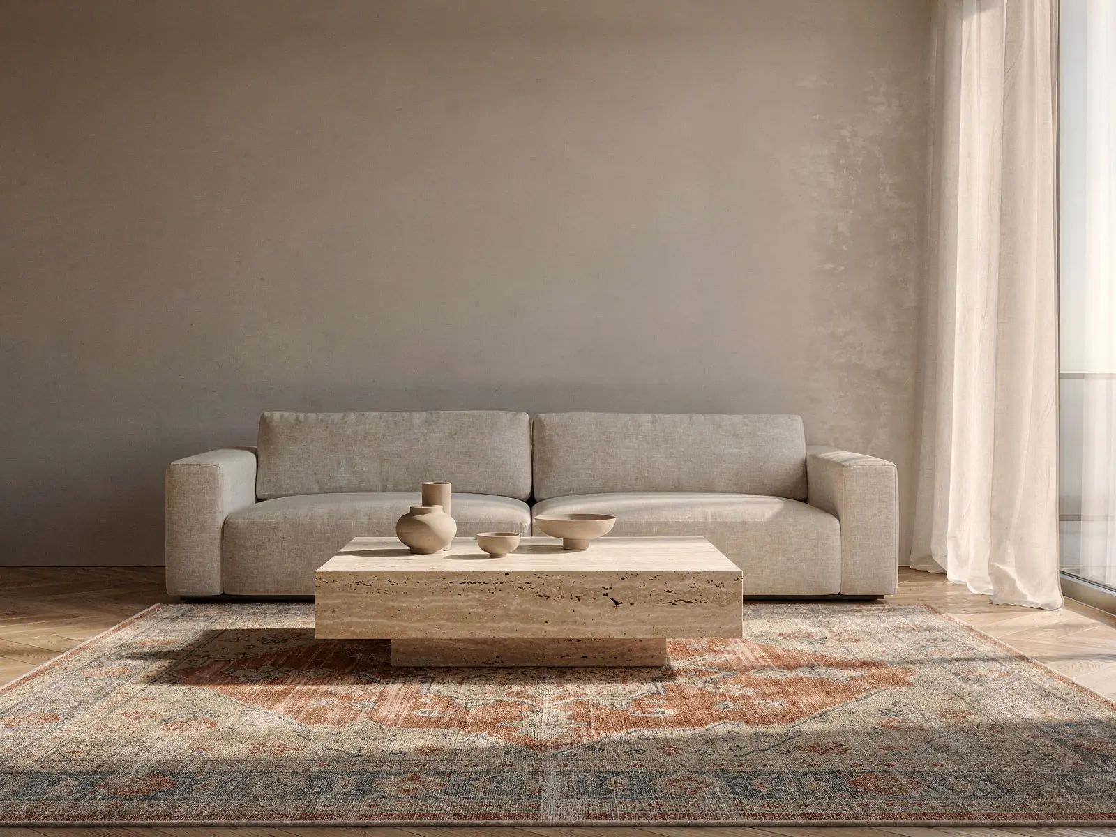 A living room with a faded vintage rug under the coffee table, after